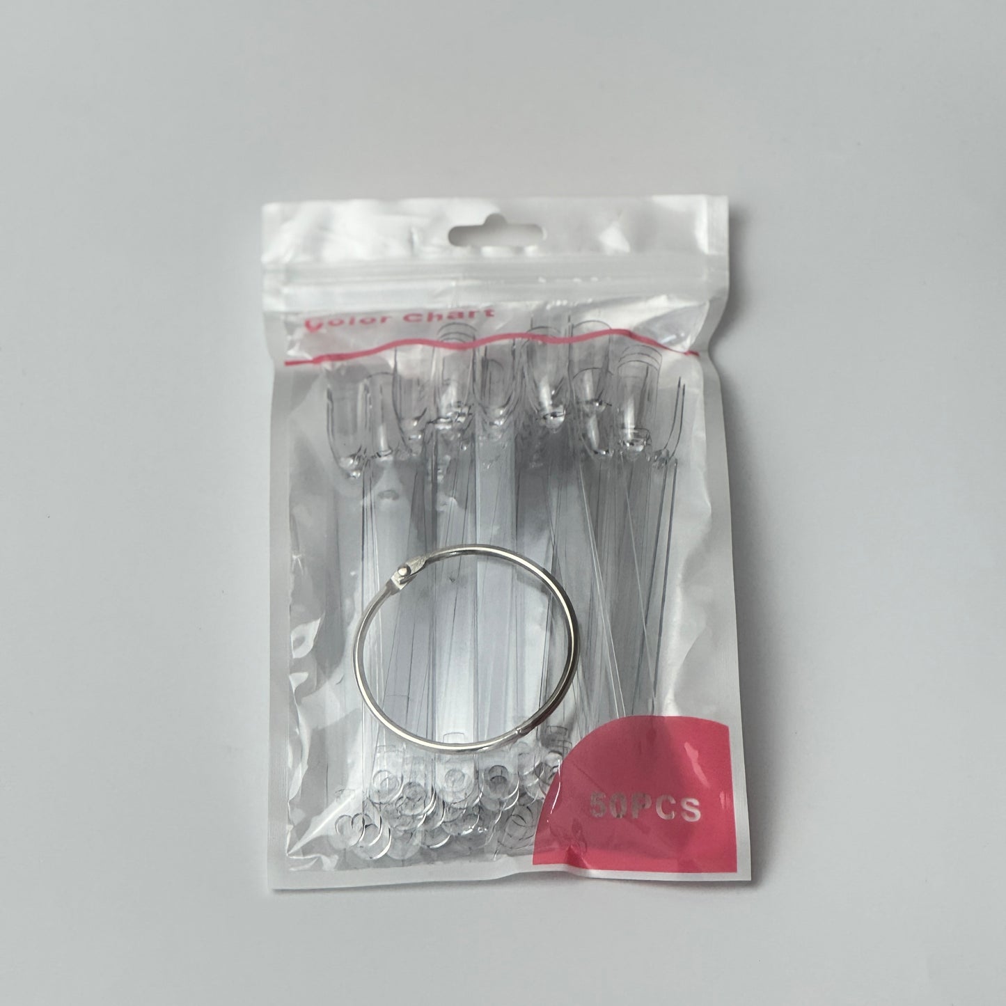 Close-up of nail swatch sticks fanned out, each showing different nail polish or dip powder shades for easy colour selection