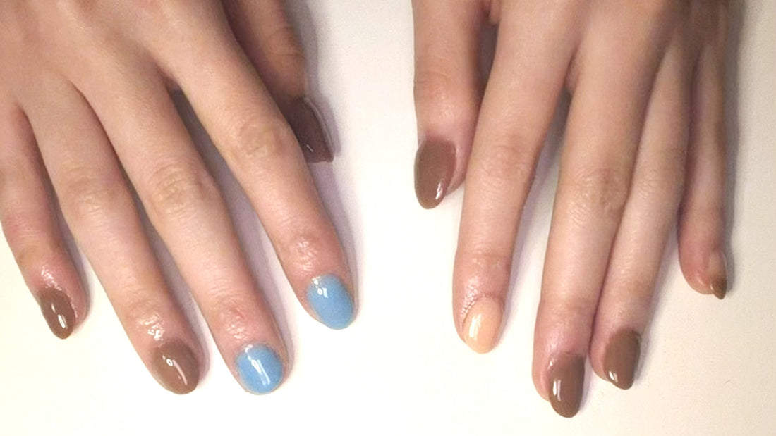 Top-down view of manicured hands with a clean, TPO-free dip powder polish resting on a natural linen background.