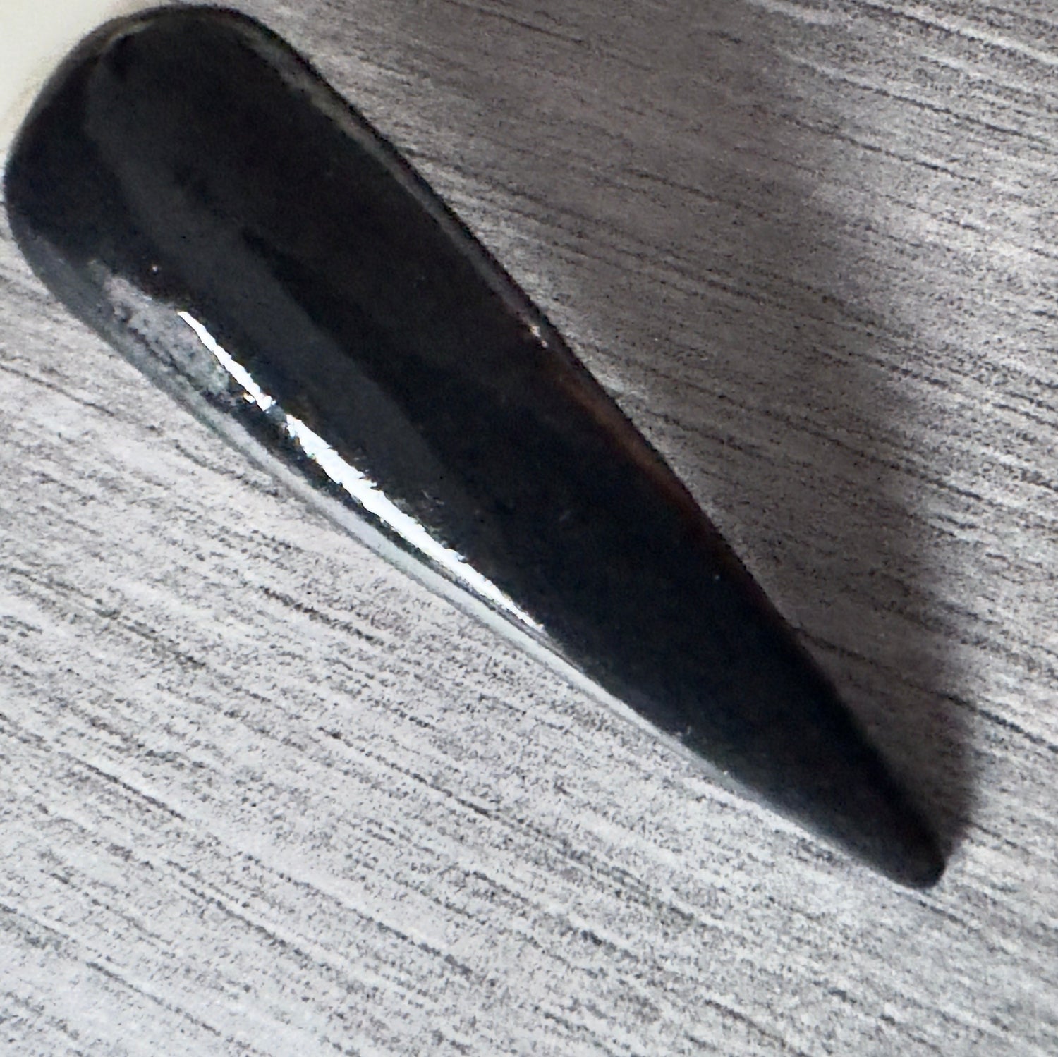 Black dip powder nails with sleek glossy finish