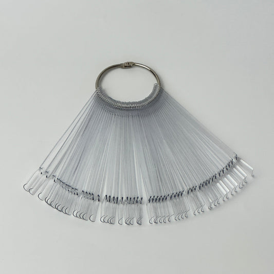 Clear acrylic nail swatch sticks showing various dipping powder and polish colours arranged in a fan displa