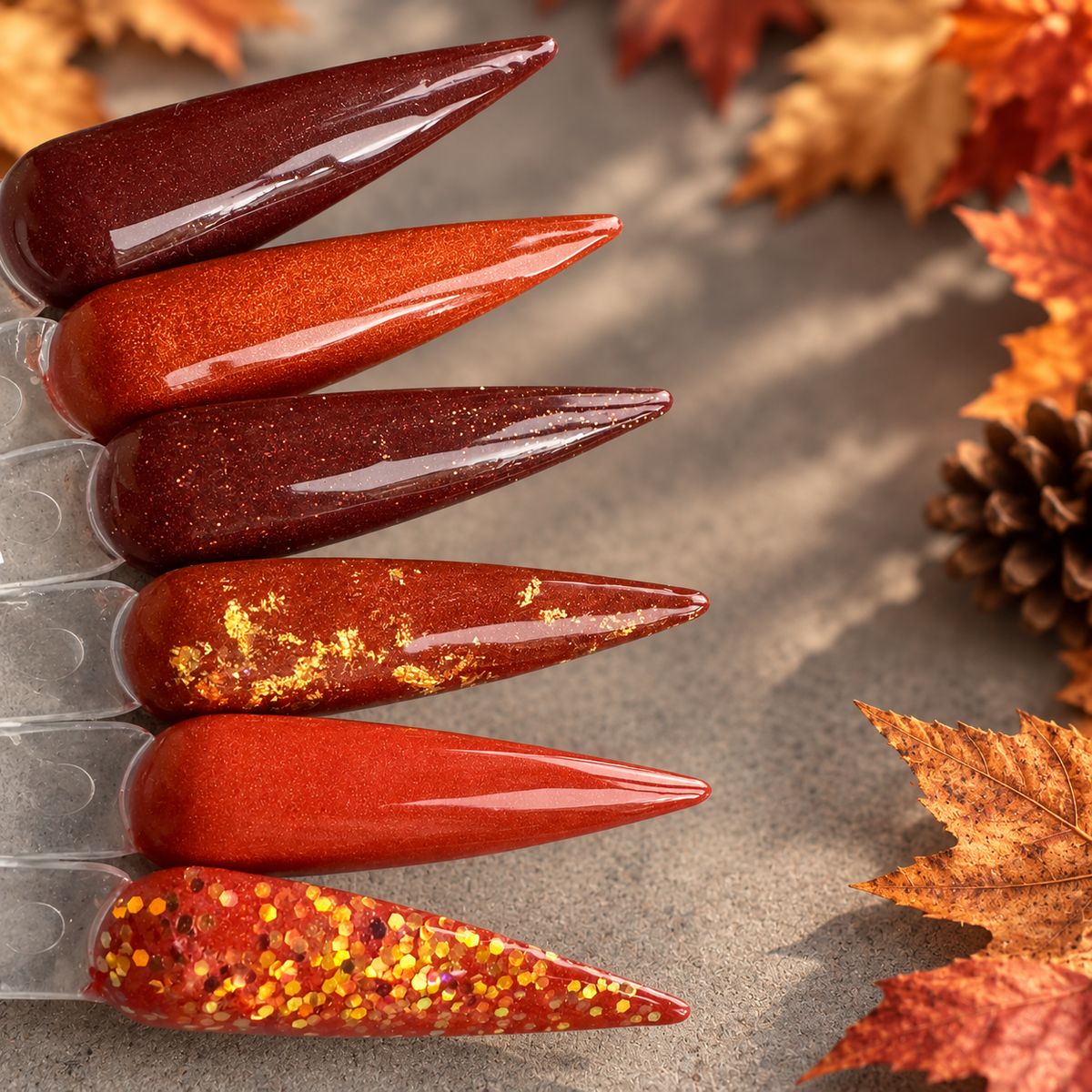 LeVeraux autumn dip powder nail swatches in deep wine, burnt orange, copper, terracotta and glitter shades