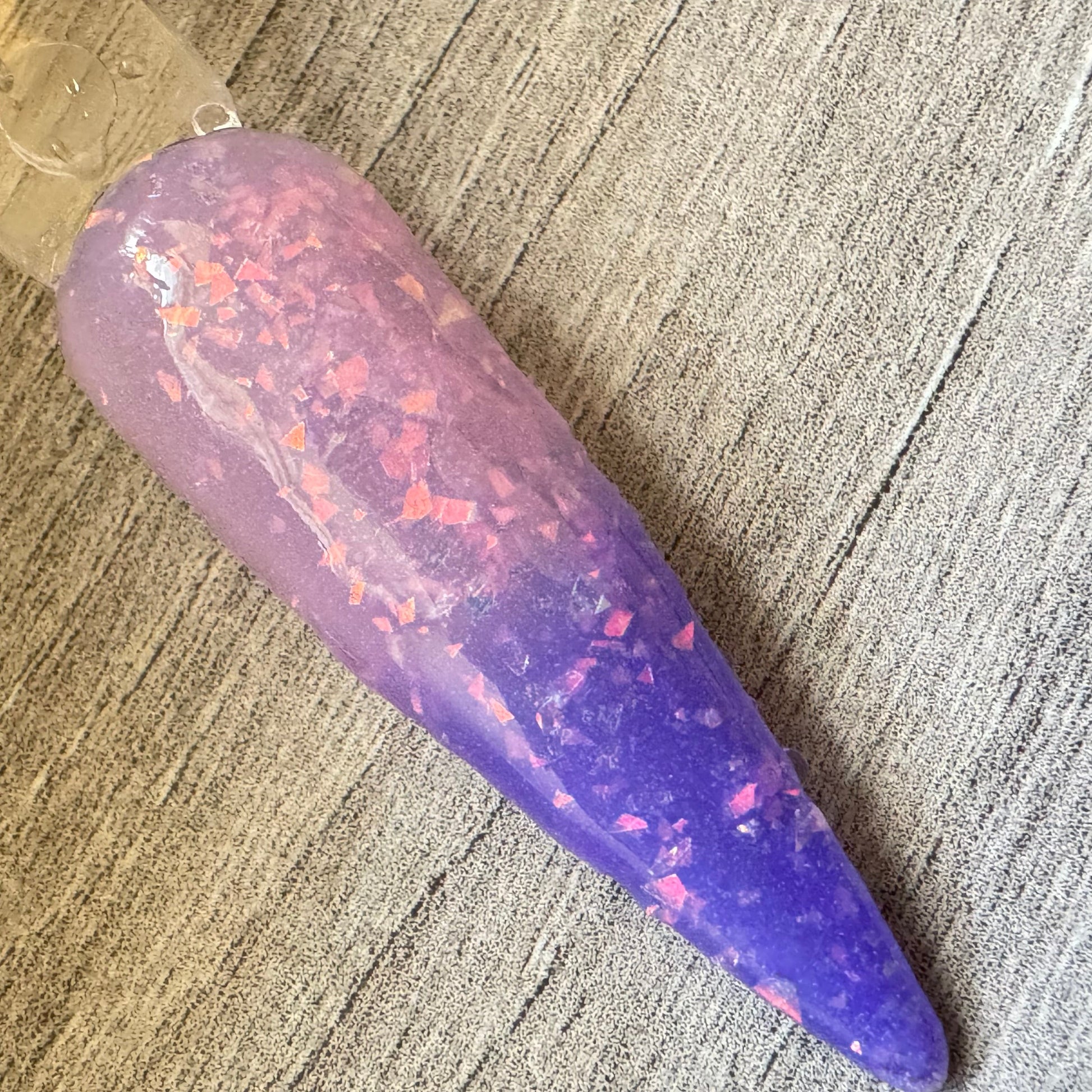 a swatch stick showing the ombre effect of colour changing thermal dip. 