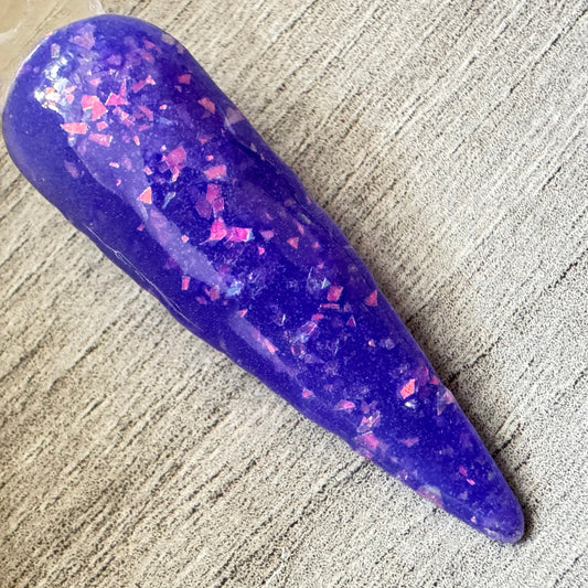 a swatch stick showing colour changing thermal dip powder in its cold state saphire blue.