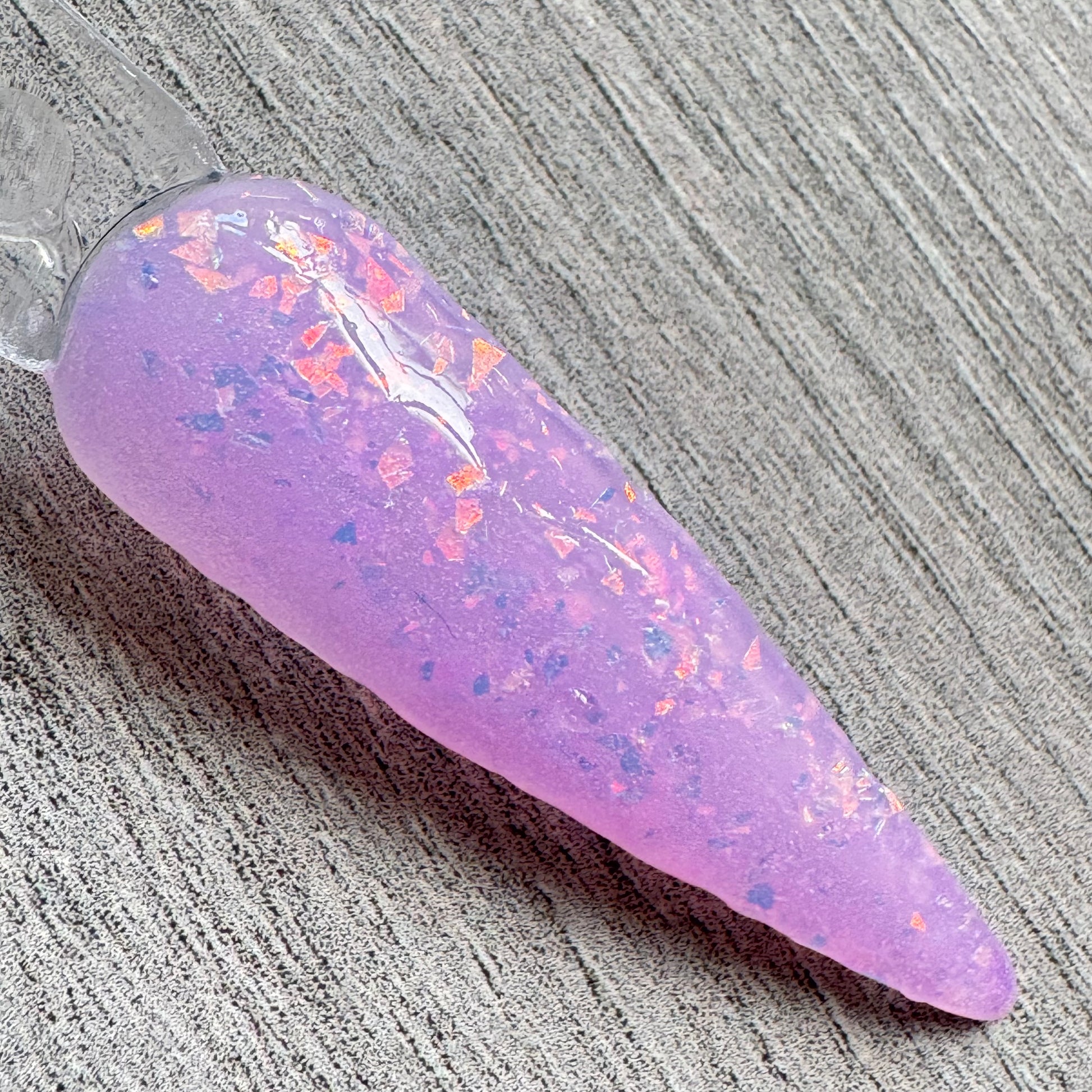  a swatch stick showing a thermal dip that has changed its colour to pink when its in hot state.